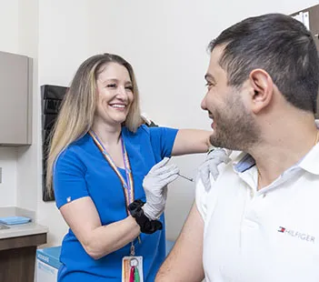 Immunization and Travel Vaccine Clinic treating a male patient